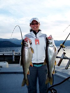 Guest displaying a freshly caught fish